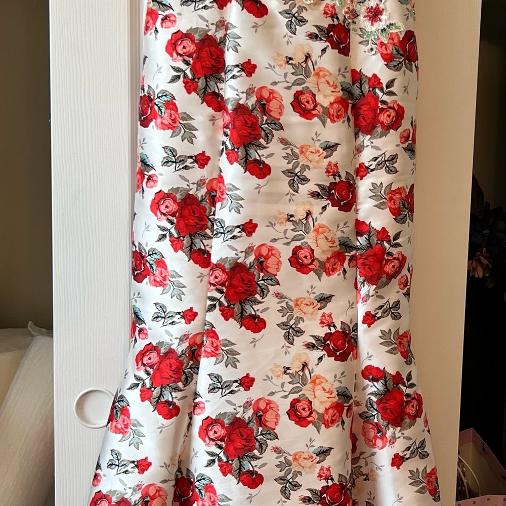 Red and Pink Ruffled mermaid dress with small train Beaded at the waist.